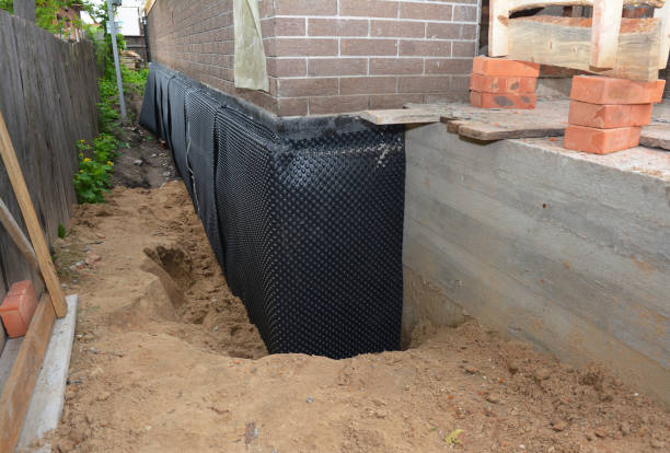 SJ Waterproofing Pros technician performing targeted Sump Pump Installation assessment in Buckner, KY